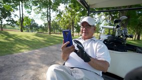 Asian senior businessman sitting on golf cart with using mobile phone working online corporate business while golfing with at country club. Elderly male golfer enjoy outdoor sport in summer vacation. - Powered by Shutterstock - Get 15% off with code: PIKWIZARD15