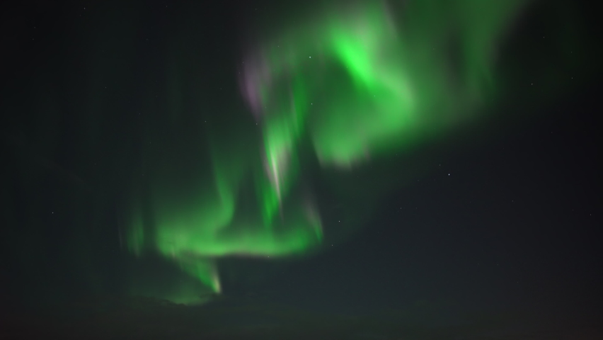 Fast moving green and purple aurora borealis realtime | Shutterstock HD Video #1083973687