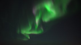 Fast moving green and purple aurora borealis realtime