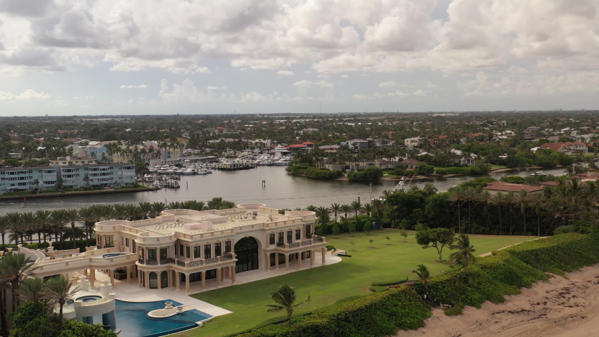 An aerial view of Hillsboro Inlet, Florida on a beautiful day with white clouds