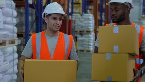 Business concept of 4k Resolution. Employees working together in the warehouse. staff holding goods.