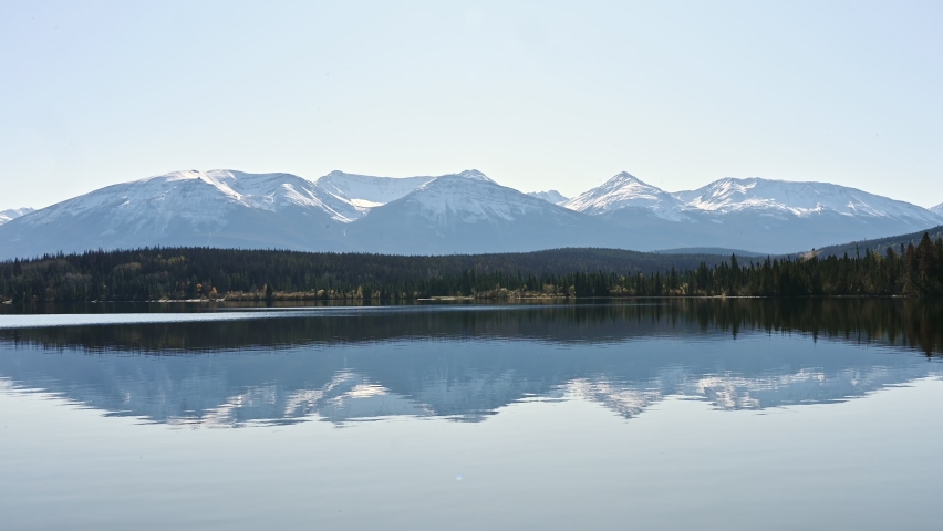 Canadian Rockies with pine forest reflection on Pyramid Lake at Jasper national park, AB, Canada