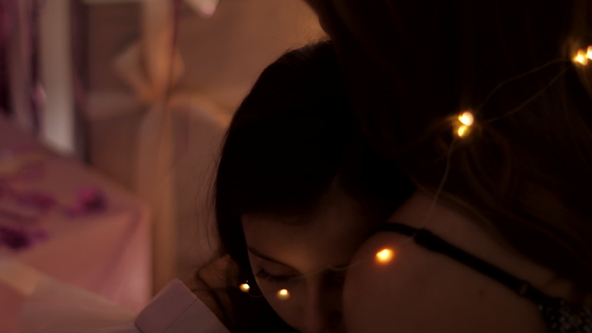 girl lies on her mother