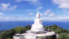 Top view Big buddha statue Phuket, Thailand. White big Buddha famous tourist travel landmark on Phuket island. Blue sea sky mountain background. Video 4k footage 2022.