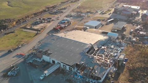 KENTUCKY - CIRCA 2021 - shocking aerial over a destroyed factory in the town of Mayfield Kentucky following a devastating tornado.