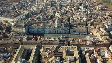 Aerial drone video of famous elliptical Piazza Navona an elegant square dating from the 1st century A.D., with a classical fountain, street artists and bars a true tourist attraction, Rome, Italy