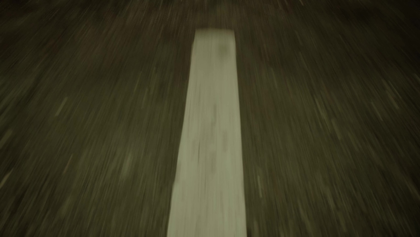 close-up cinematic POV shot of an wet asphalt road. Car is driving on the highway  Royalty-Free Stock Footage #1084002313