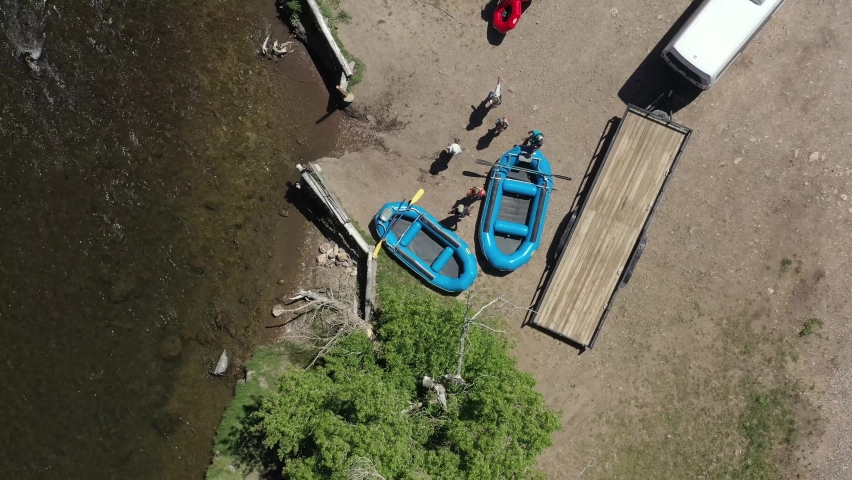 Aerial rafts on Provo River, Utah floating down river in summer sun fun activity