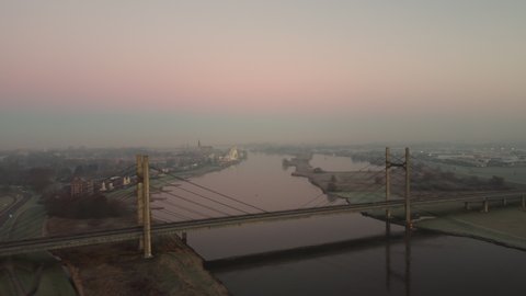 Aaerial view over the Molenbrug over the river Ijssel during sunrise during a cold winter morning in Overijssel, Netherlands.