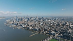 Aerial panoramic footage of large city with various buildings. blocks of multistorey houses in neighbourhoods and downtown business skyscrapers. Manhattan, New York City, USA