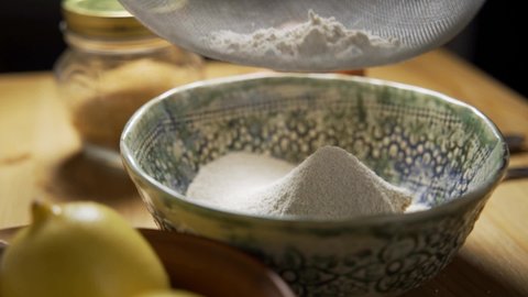 Flour is sifted through a sieve. Preparing ingredients for cooking. Baking and pastry.