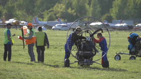 MOSCOW REGION, CHERNOE AIRFIELD 22 May 2021: Paragliding check before the flight how the engine and propeller work.