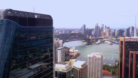 NORTH SYDNEY, NSW, AUSTRALIA – DECEMBER 12, 2021:  Aerial drone view of North Sydney CBD with Sydney City, the Sydney Harbour and Harbour Bridge in view