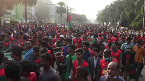Dhaka, Bangladesh - December 13, 2021: On the occasion of the golden jubilee of Bangladesh's independence, the Bangladeshi people rallied with the national flag in front of the parliament building.