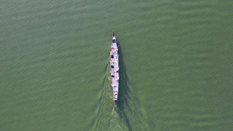 Aerial drone top view of sport canoe rowing team of athletes competing 