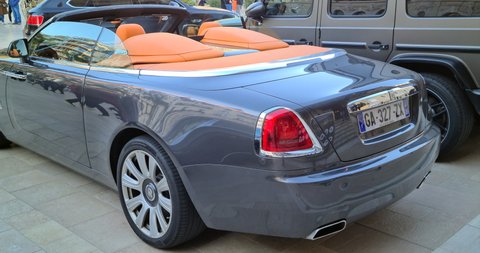 Monte-Carlo, Monaco - December 12, 2021: Luxury Silver Rolls-Royce Dawn Cabriolet Parked In Front Of The Monte-Carlo Casino In Monaco On The French Riviera, Europe. Close Up Rear View - DCi 4K Video