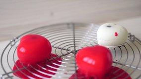 Glazing of individual mousse cakes with red glaze - Powered by Shutterstock - Get 15% off with code: PIKWIZARD15