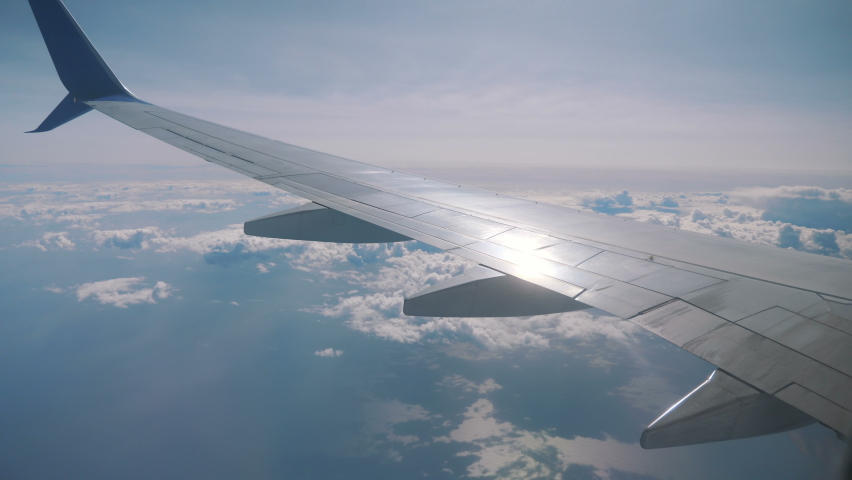 Airplane flight above the clouds in 4K Royalty-Free Stock Footage #1084043335