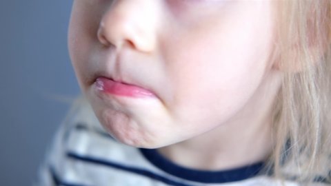 child, girl 2 years old, close-up of part of child's face, children's mouth open, concept of sensory feelings, speech disorders, correction, methods of correctional developmental exercises