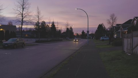 Fraser Heights, Surrey, Vancouver, British Columbia, Canada - December 5, 2021: View of Residential Suburban Neighborhood Street in a modern city. Frosty Cloudy Morning Sunrise Sky.