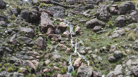 pampas galeras waterfall among rock cliff Apurimac, Peru