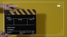 Clapper board. Close up hand and film making clapperboard isolated on background studio. Movie or video production concept. Clappers board Shuts. Film crew holds film slate in hand for video recording