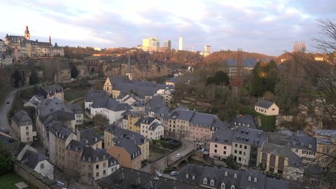 Panoramic view of the Lower Town of Luxembourg City at sunset with Kirchberg skyline in the background