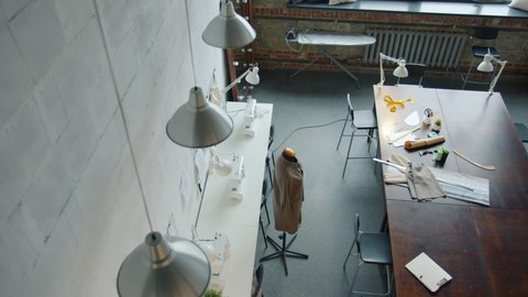 Top view of modern tailoring studio with furniture equipment and dummy and no people around. Workplace and occupation concept.