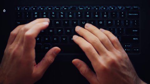 Freelancer typing on keyboard. Time lapse video clip of man working on laptop, filmed in 4K ultra hd directly from above. Royalty free stock footage of male hands type text on notebook computer