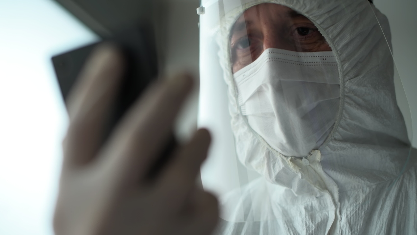 Medical professional during video call on smartphone, close up with selective focus