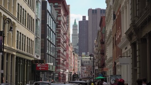 NEW YORK, USA - MAY, 18, 2021: Old historic buildings in Midtown New York in the Soho District. Architecture of Manhattan on a sunny day, city streets. House with fire emergency escapes stairs.