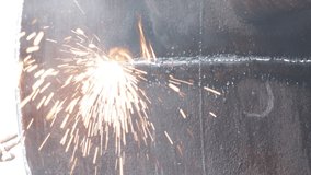 footage of workers cutting iron sheets using a cutting welding