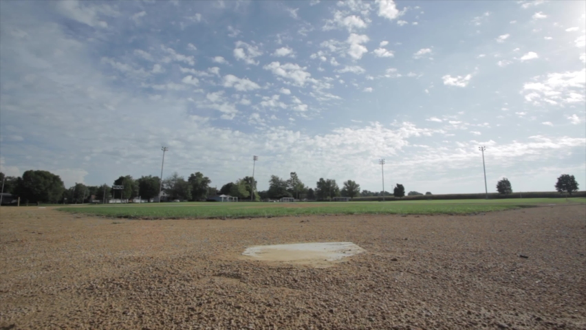 Empty and lonely home base on a baseball field
