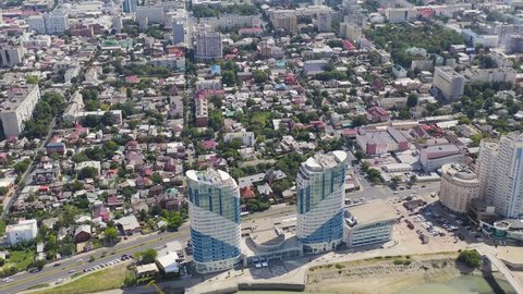 Krasnodar, Russia. New residential buildings on the Kubanskaya embankment. The Kuban River. Flight over the city in summer, Aerial View Hyperlapse, Departure of the camera