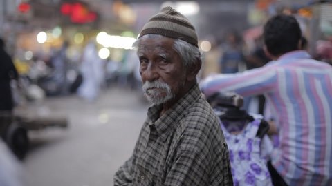 Muslim Indian Old man standing at the street of Mumbai, India