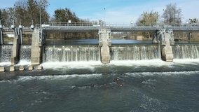 Weir river hydroelectric power station water Morava high cascading, drone aerial video shot river quadcopter view flying fly flight show, hydro electric sluice floodgate water-gate waterfall, Europe