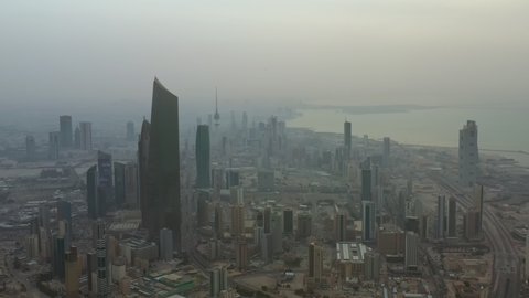 Kuwait City, Kuwait - February 24, 2020: Aerial view of Kuwait City financial district and Kuwait City in sunrise  fog.