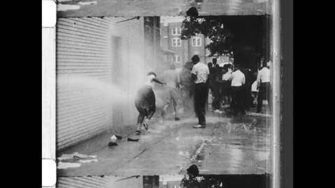 1963 Birmingham, AL. High powered hoses used on African-American civil rights demonstrators. Commissioner Bull Connor orders violence against peaceful protesters. 4K overscan of Vintage Archival Film 