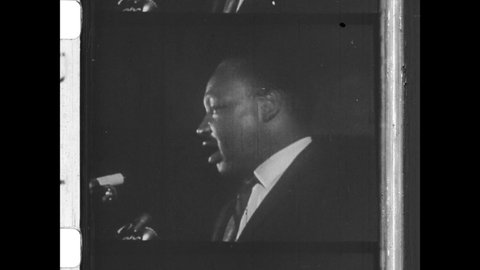 April 3, 1968 Memphis, TN. The day before his assassination, Martin Luther King, Jr delivers his last speech to a group of sanitation workers in Memphis, Tennessee. 4K Overscan of 16mm Newsreel Film