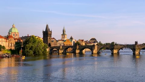 Charles Bridge in Prague in Czechia, Prague, Czech Republic. Charles Bridge (Karluv Most) and Old Town Tower. Vltava River and Charles Bridge, concept of world travel, sightseeing and tourism.