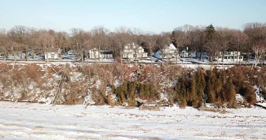 Cinematic Aerial Footage Along Shoreline of Frozen Lake Michigan