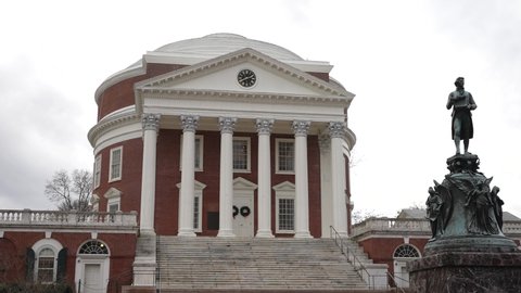 Charlottesville, VA, USA - 12 11 2021: Statue of Thomas Jefferson in front of the Rotunda on the University of Virginia, UVA campus.