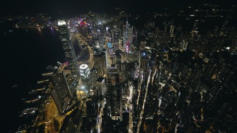 Hong Kong, China, Asia - Dec 2021: Drone Night Shot Panorama View of Hong Kong City Skyline Central Business District