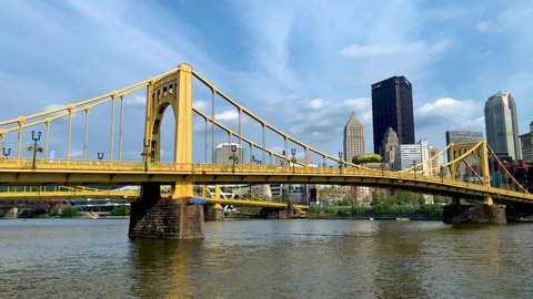 Pittsburgh , Pennsylvania , United States - 08 21 2021: Andy Warhol Bridge seen from the Allegheny river waterfront with the Pittsburgh downtown in the background