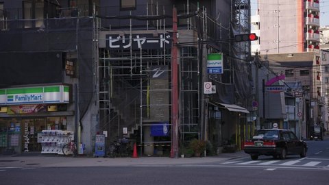 Osaka , Japan - 11 01 2021: Slow panning establishing shot of prostitution area in Japan