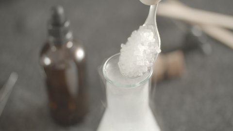 tablespoon of dry ice into water causes flow of white vapor