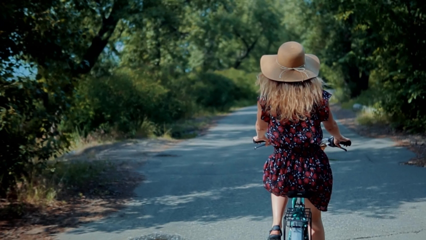 Woman Cyclist Riding Road Bike. Cycling Leisure And Hobbies. Woman Riding Mountain Bike In Park. Beautiful Girl Cyclist On Vacation. Bicycling On Holidays. Pretty Girl Having Fun. Bicycle Adventure  Royalty-Free Stock Footage #1084165312