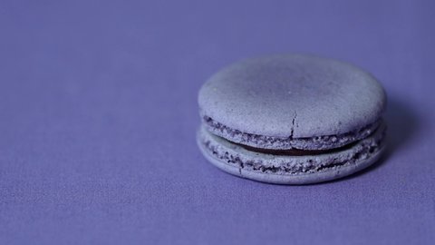 4K Very Peri. Barvinok. Color of the year 2022 concept. Macaroon almond cake in trendy color on top background. Shades of lilac, purple, lavender. French dessert. Inspired by 17-3938