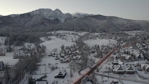 Panoramic View at Zakopane and Giewont Mount in Cold Winter Morning. Drone Aerial View at City in Snow