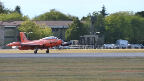 Rivolto del Friuli Italy SEPTEMBER, 17, 2021 Historic military training jet aircraft with high visibility orange color lands. Aermacchi MB-326 by Volafenice